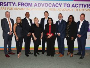 Mike Haynie and 8 other inductees to the ADvancing Diversity Hall of Honor posing for picture.