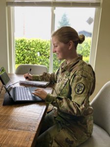 Woman veteran sitting at laptop.